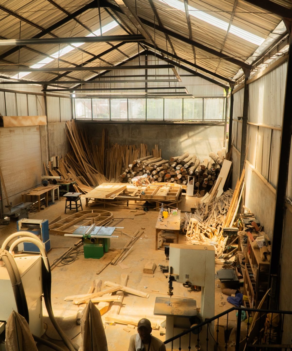 Arania Bali woodworking workshop with timber stock and machinery