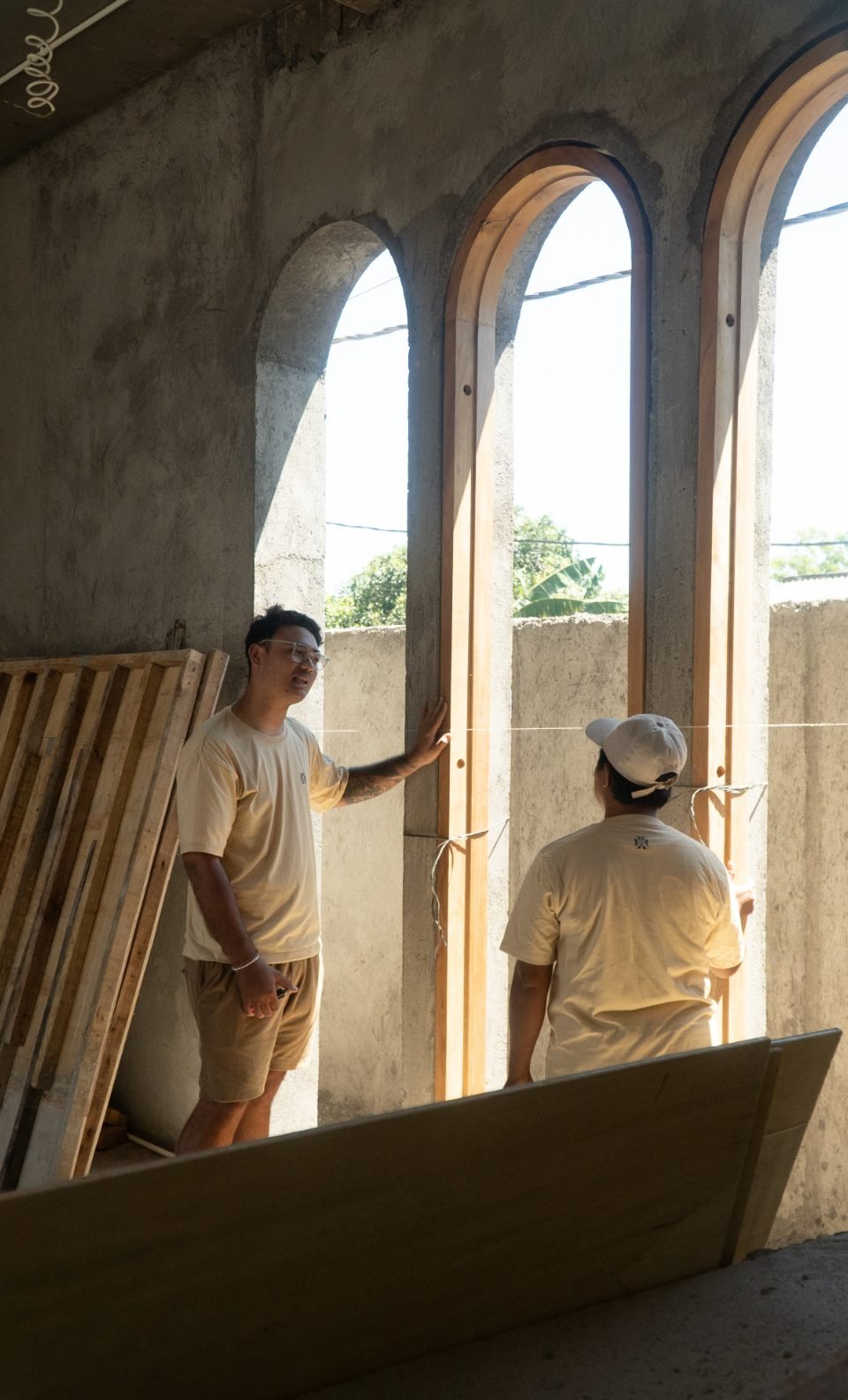 Arania team on site with a custom arched window frame