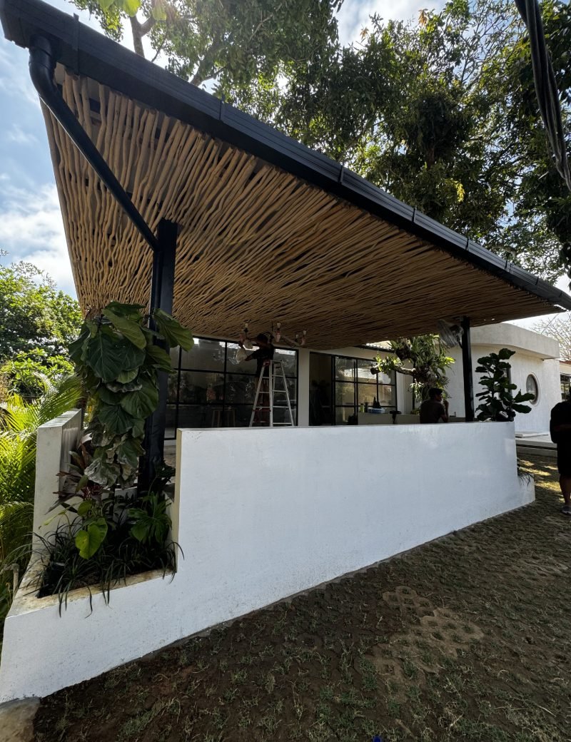 Open-air pavilion with timber and bamboo roof built by Arania Bali