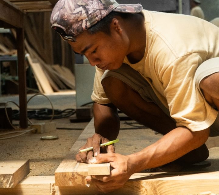 Arania craftsman shaping timber by hand