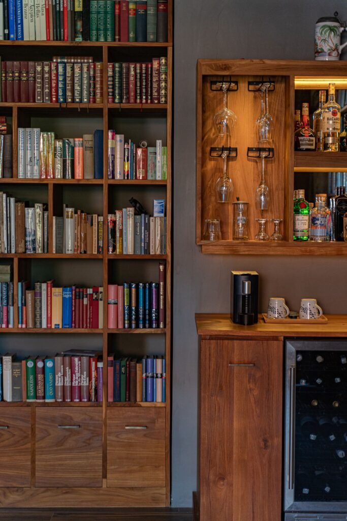 Built-in teak library bookshelf with home bar cabinet by Arania Bali